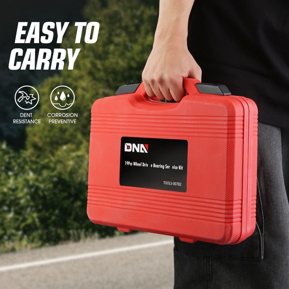 DNA MOTORING kit on garage workbench with tools and wheel hub showing practical workshop readiness
