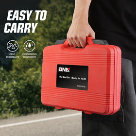 DNA MOTORING kit on garage workbench with tools and wheel hub showing practical workshop readiness