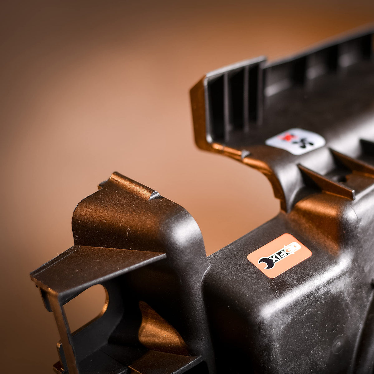 Dorman condenser fan shroud close-up illustrating redesigned fit for easier installs