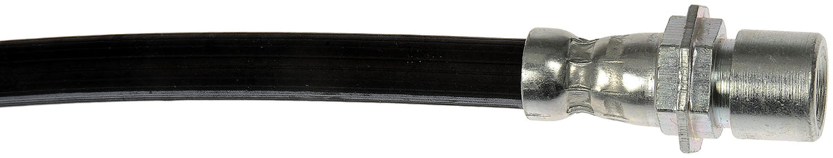 Dorman hose installed on vehicle front driver side demonstrating correct routing benefit
