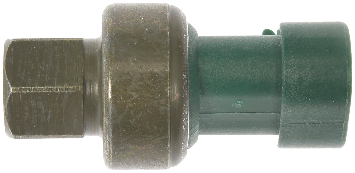 Dorman pressure switch beside ruler for scale to confirm fit and installation ease