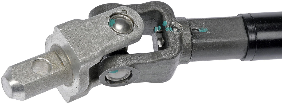 Dorman steering shaft beside a ruler for scale illustrating correct length and fitment