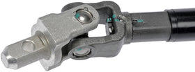 Dorman steering shaft beside a ruler for scale illustrating correct length and fitment