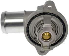Dorman thermostat housing installed in engine bay illustrating direct-fit replacement convenience