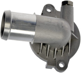 Dorman thermostat housing held in hand to show scale and ease of handling during install