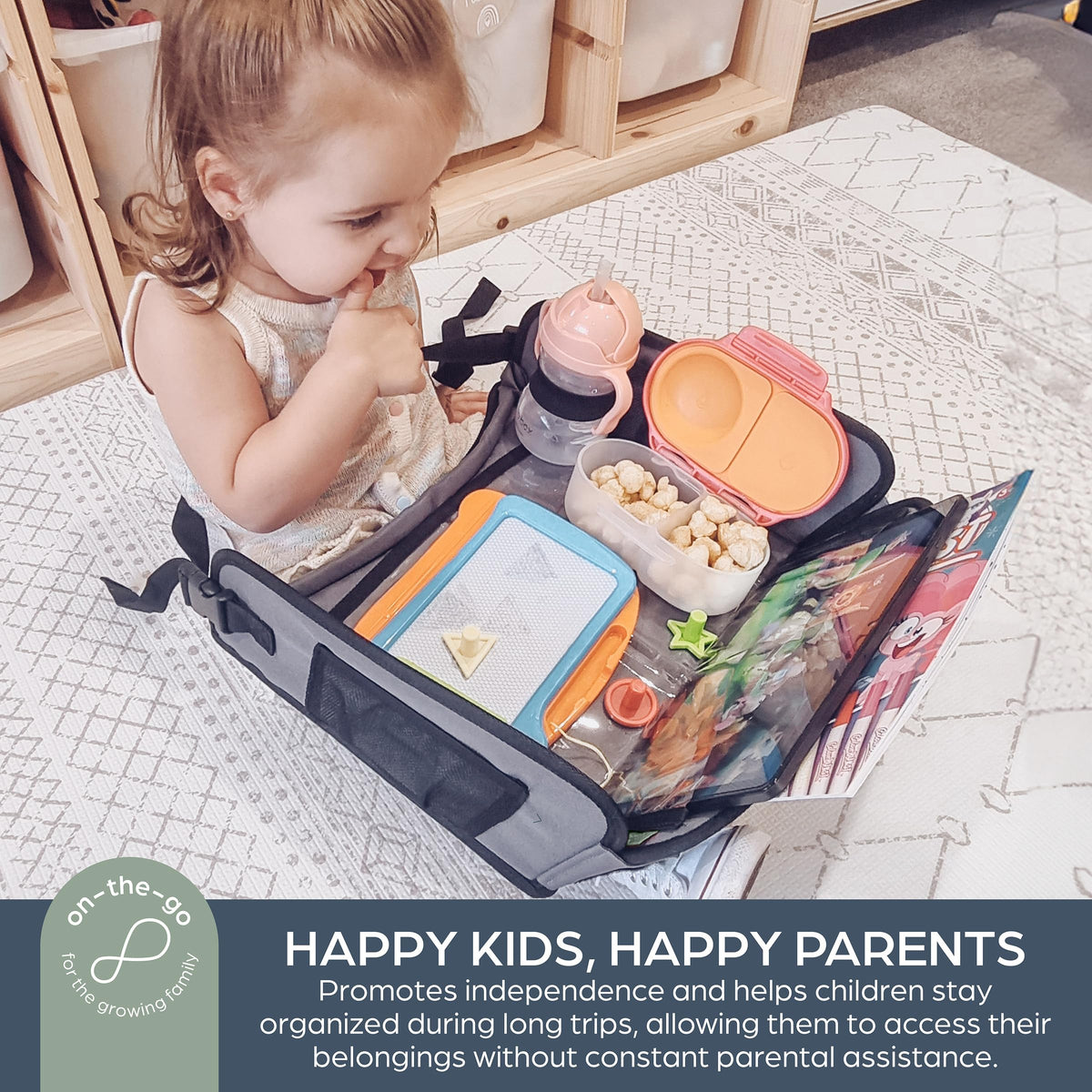 Dreambaby tray in use by children in a car providing stable activity surface