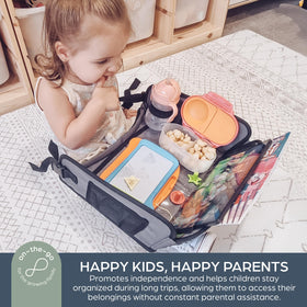 Dreambaby tray in use by children in a car providing stable activity surface