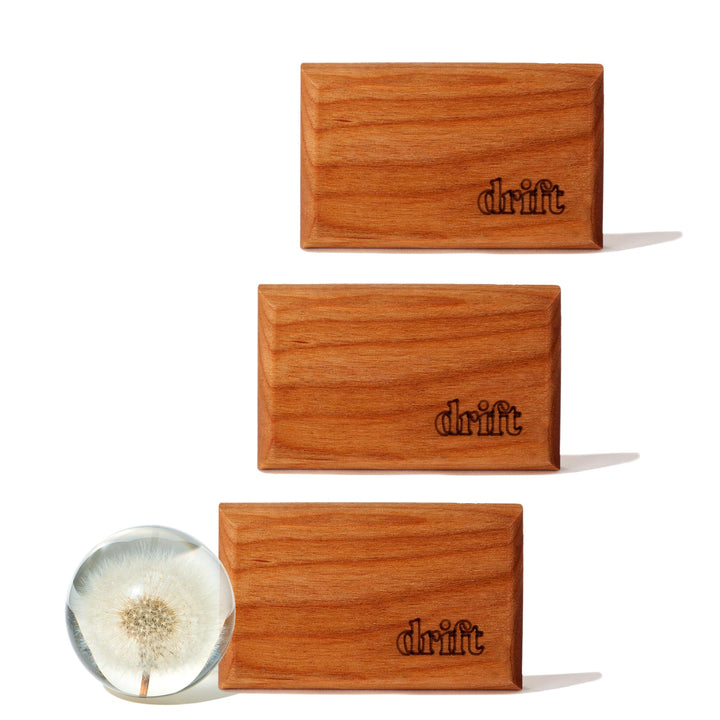 drift front packaging showing three open air wood refills and benefit of long-lasting scent