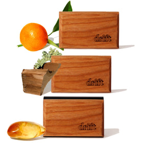 drift front packaging showing three wood scent blocks and metal clip, clean design benefit