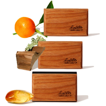 drift front packaging showing three wood scent blocks and metal clip, clean design benefit