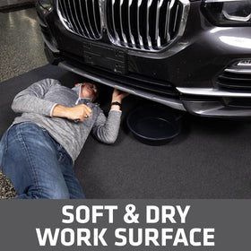 Drymate under a parked car catching oil drips for clean garage