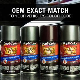 Dupli-Color can held beside a hand for scale showing compact 8 oz convenience