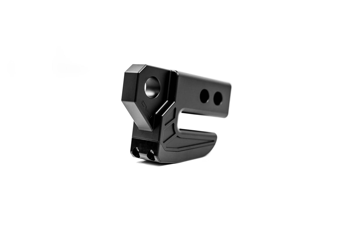 DV8 Offroad next to hitch pin for scale showing compact heavy-duty thickness