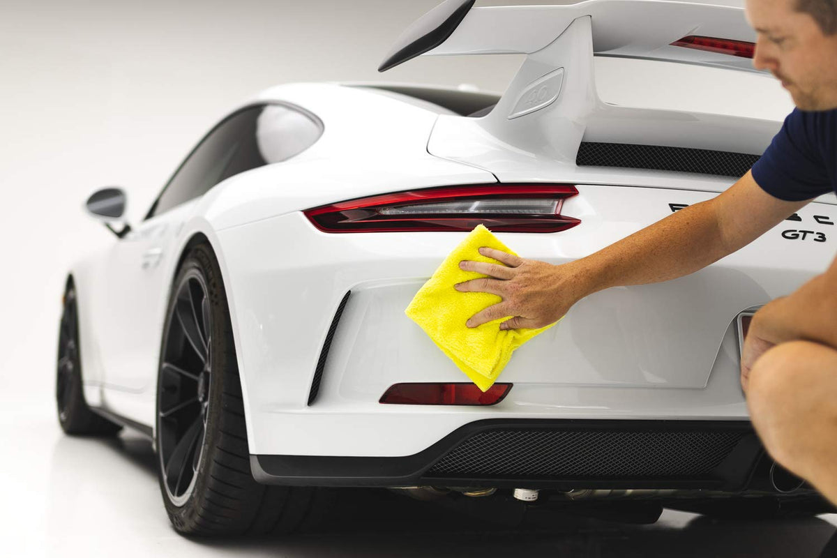 Towel next to ruler showing 16x16 size and scale, The Rag Company benefit: precise fit for detailing