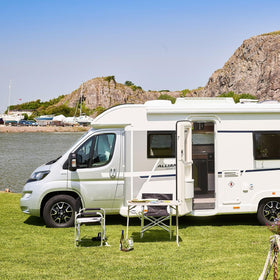 Earthtec 65528 on RV at campground showing durability and weather protection