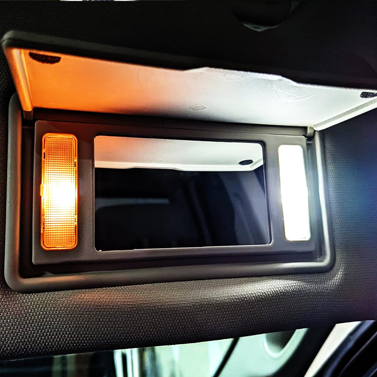 EASY EAGLE LED bulbs beside a coin showing compact size and easy fitment