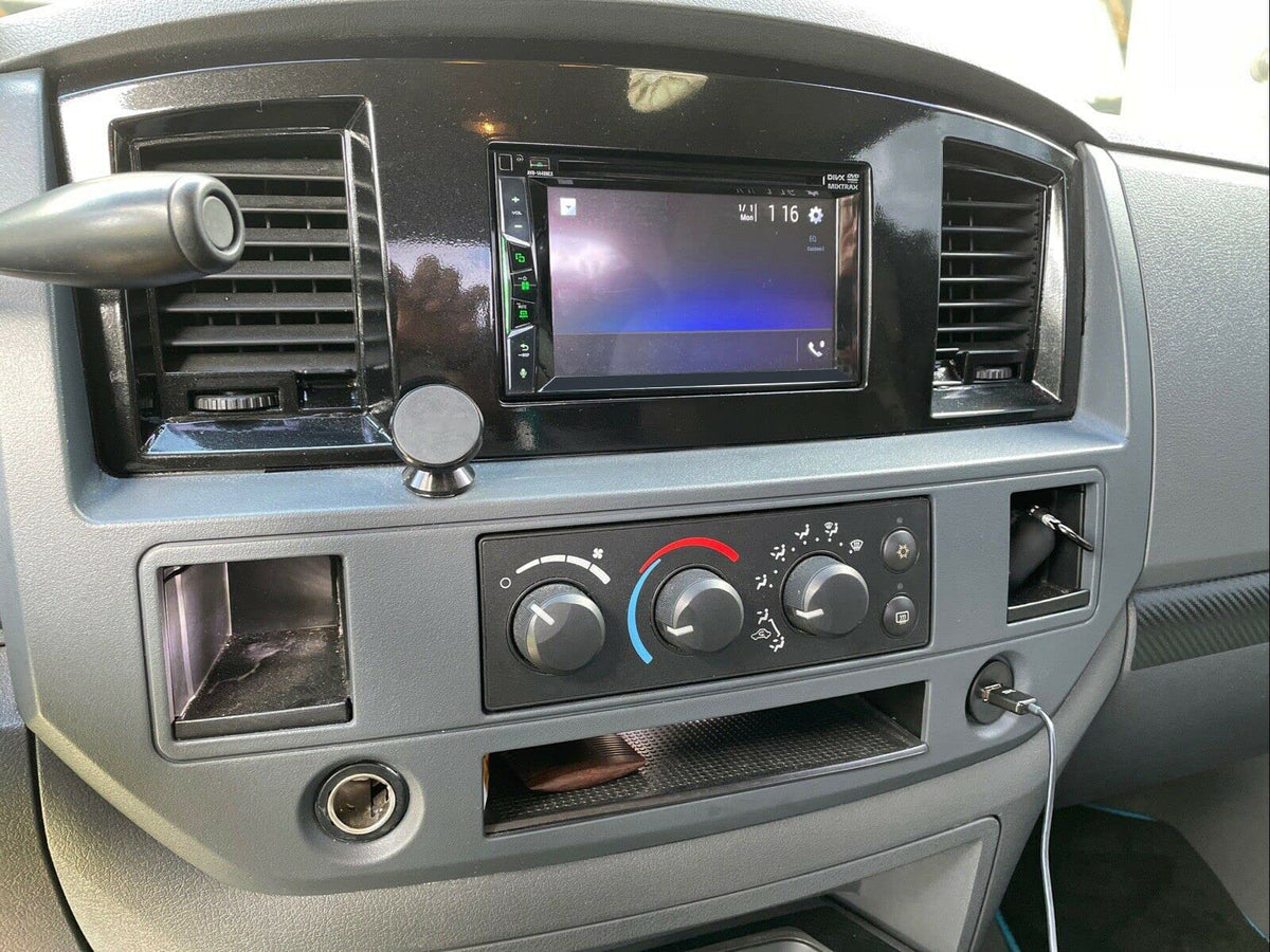 ECOTRIC bezel next to a ruler for scale showing correct sizing for double DIN radios benefit