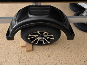 ECOTRIC fender skirt detail blocking road spray to protect wheel well