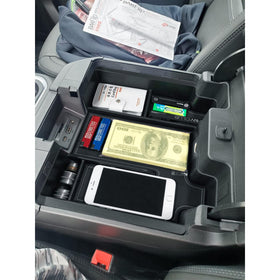 EDBETOS lifestyle shot inside truck with organized console, reduces clutter