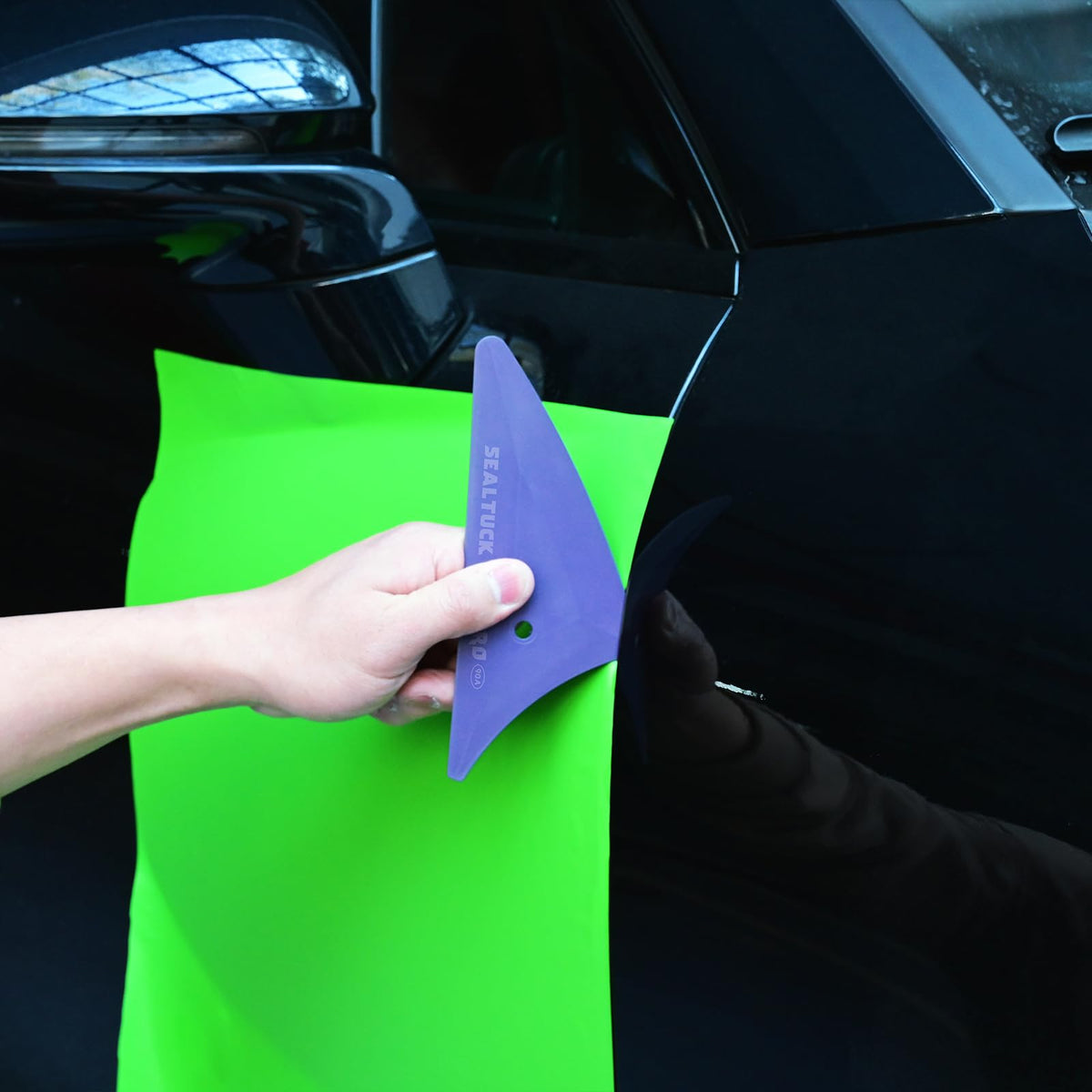 EHDIS kit arranged with vinyl wrap and tools showing multi-purpose use for wraps and decals