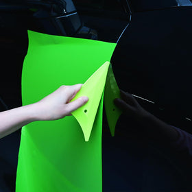 EHDIS squeegees next to a ruler showing scale and compact design for handheld control