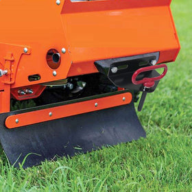 EilxMag mower pulling small trailer in yard illustrating practical towing capability