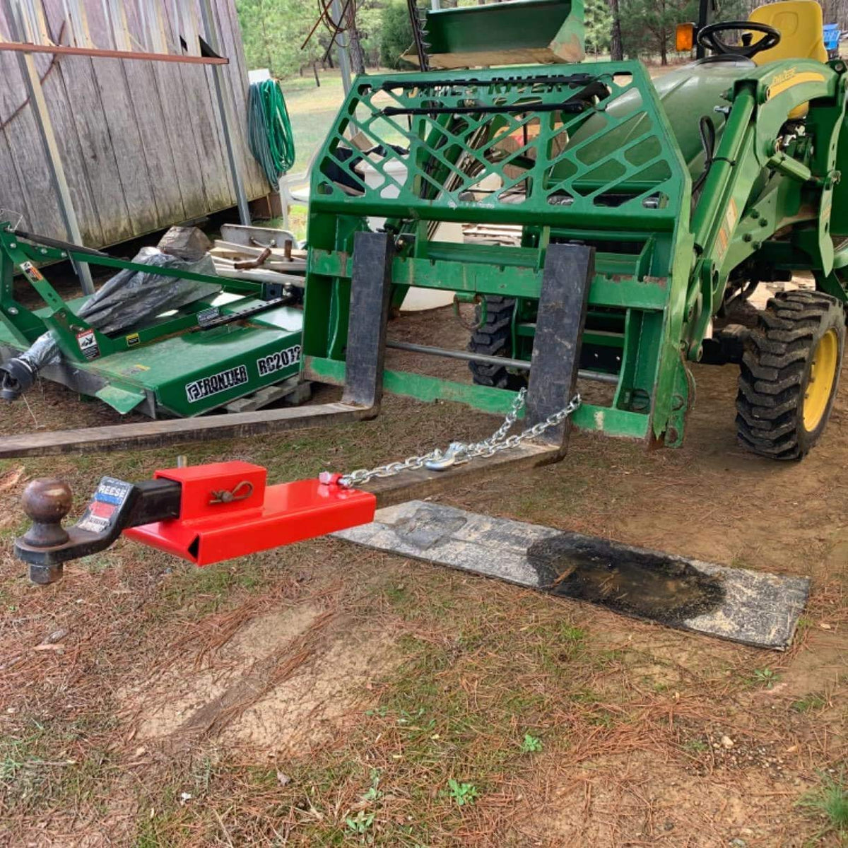 ELITEWILL towing a trailer in a yard showing versatile use across jobsites