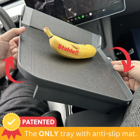 Ennovatools tray mounted in Model Y demonstrating stable eating surface benefit