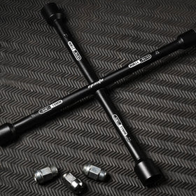 EPAuto wrench in use loosening lug nut for faster roadside tire change