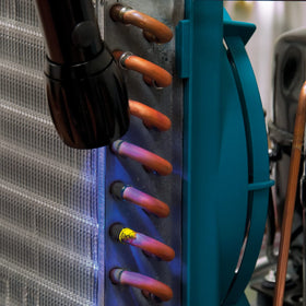 Errecom Brilliant bottle beside a car A/C service port, brand enabling faster vehicle diagnostics
