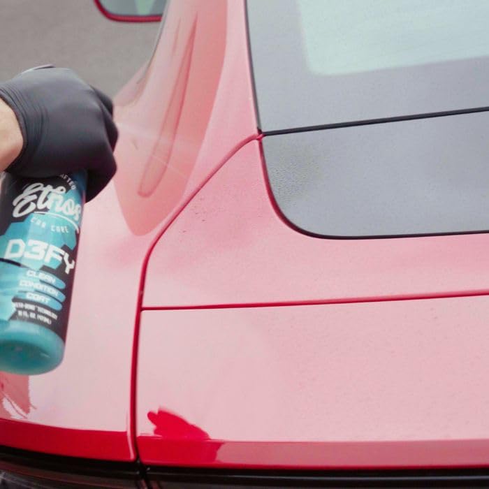 Microfiber wiping Ethos Defy off paint illustrating gentle cleaning and polish