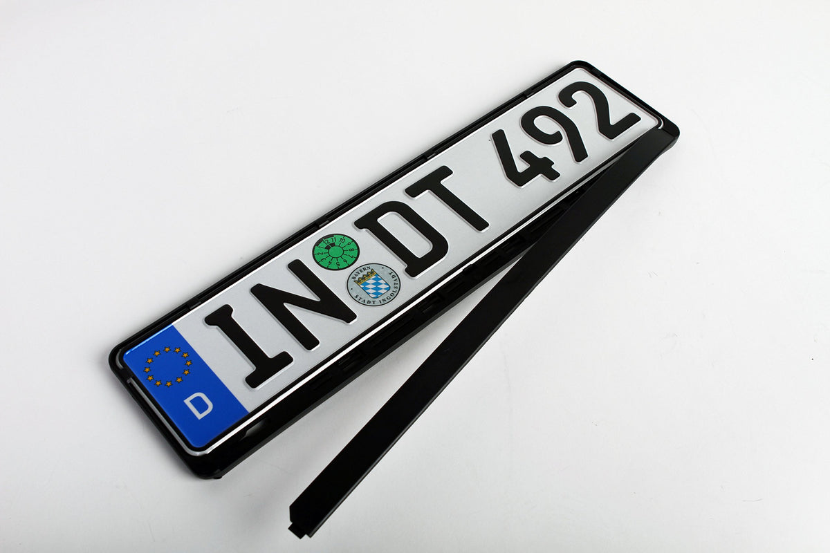 European License Plates flex demo bend in hand illustrating durable flexibility
