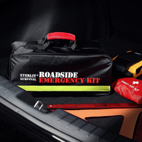EVERLIT nighttime roadside setup with triangle and flashlight boosting visibility