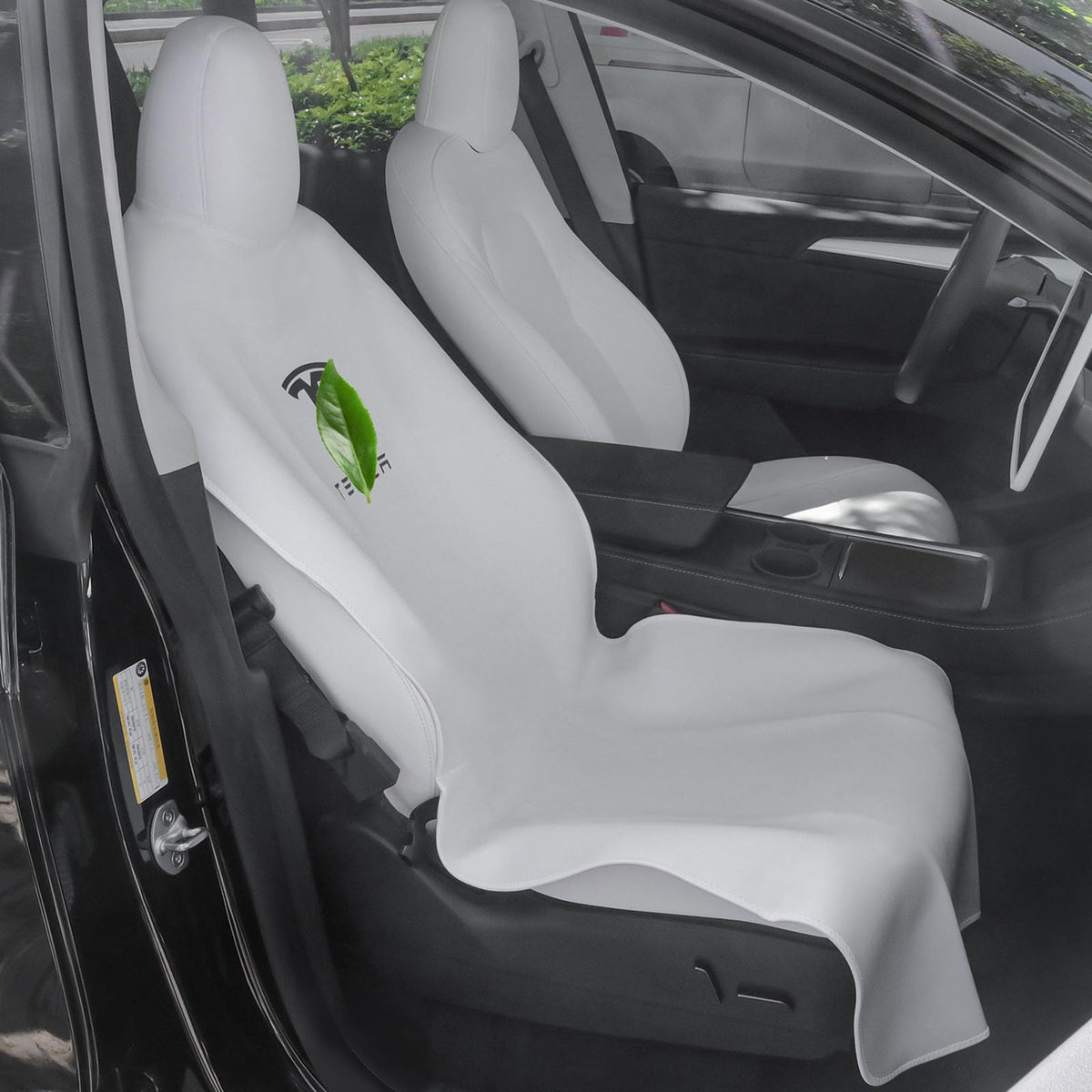 EVMODS front seat packaging showing compact single-piece protector and accessories benefit protection