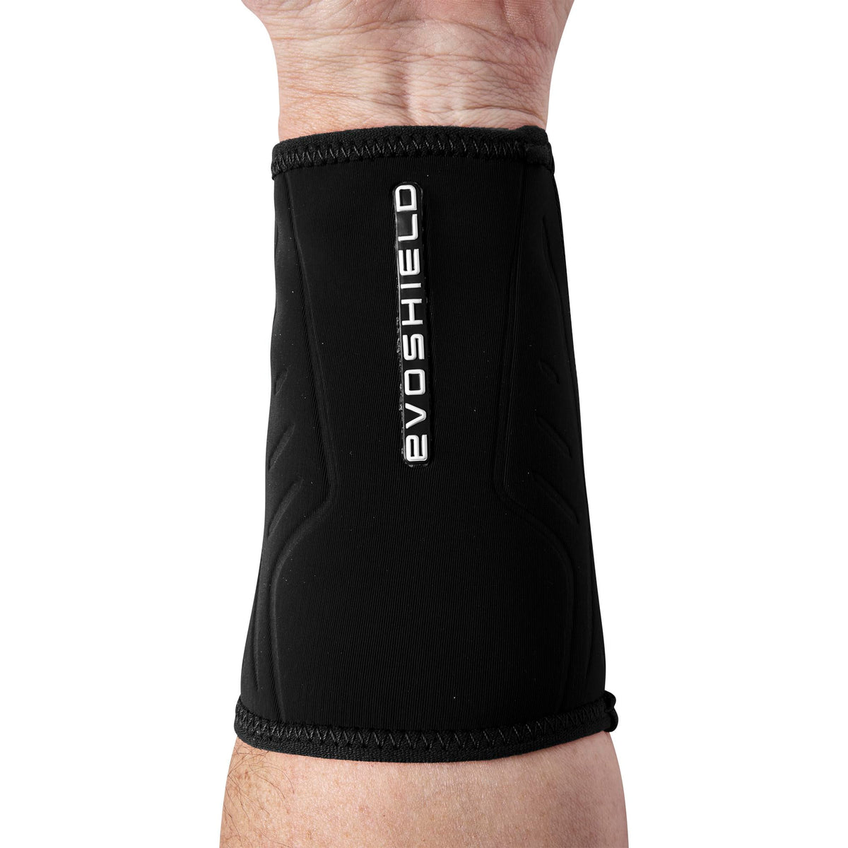 EvoShield wrist guard next to a ruler showing medium size and accurate fit