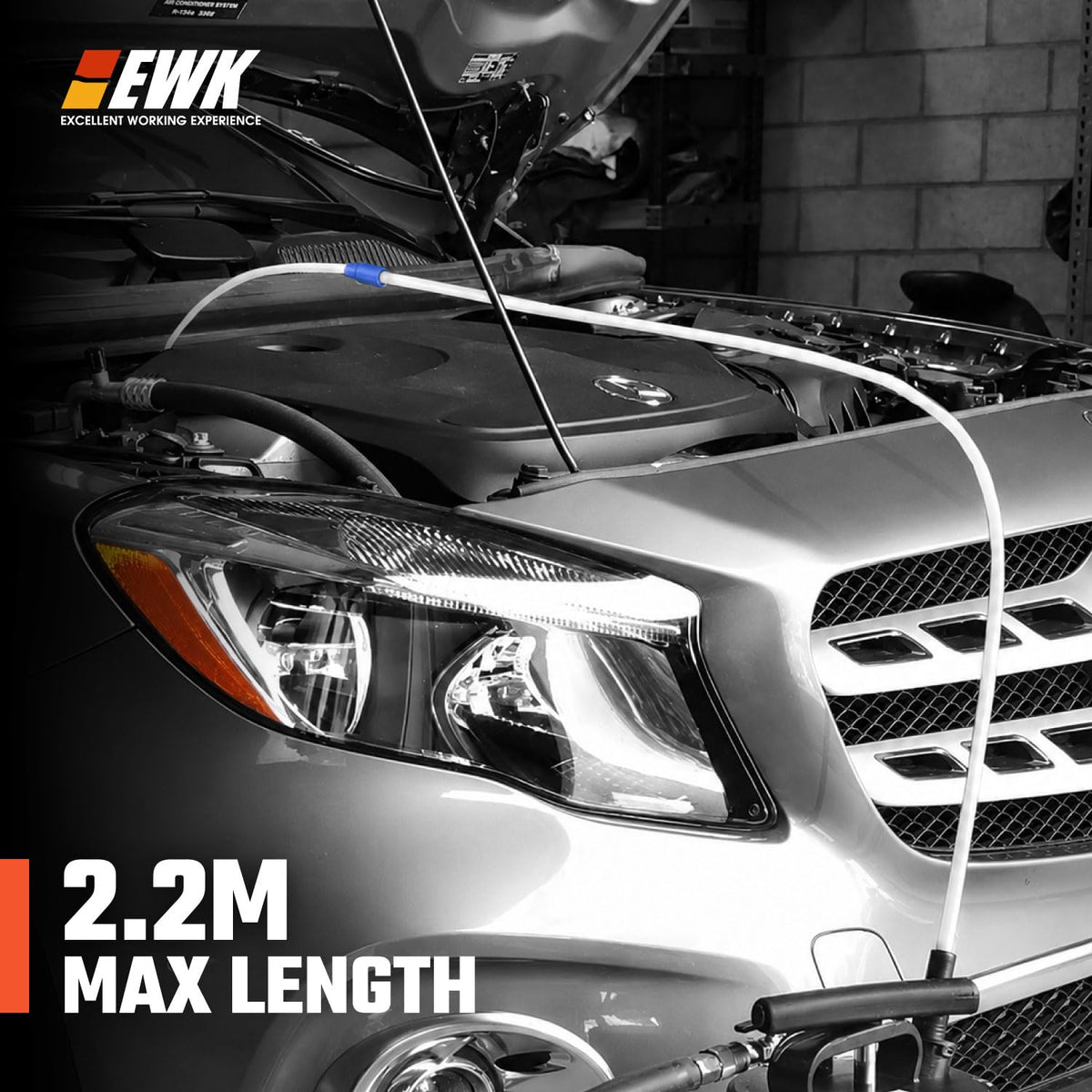 EWK hose inserted into engine oil pan demonstrating deep reach benefit