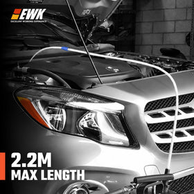 EWK hose inserted into engine oil pan demonstrating deep reach benefit