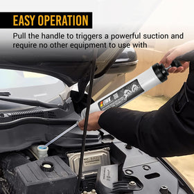 EWK in use extracting transmission fluid from tight reservoir for neat maintenance