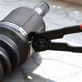Exclaith banding tool in use tightening a CV boot clamp, fast reliable tensioning