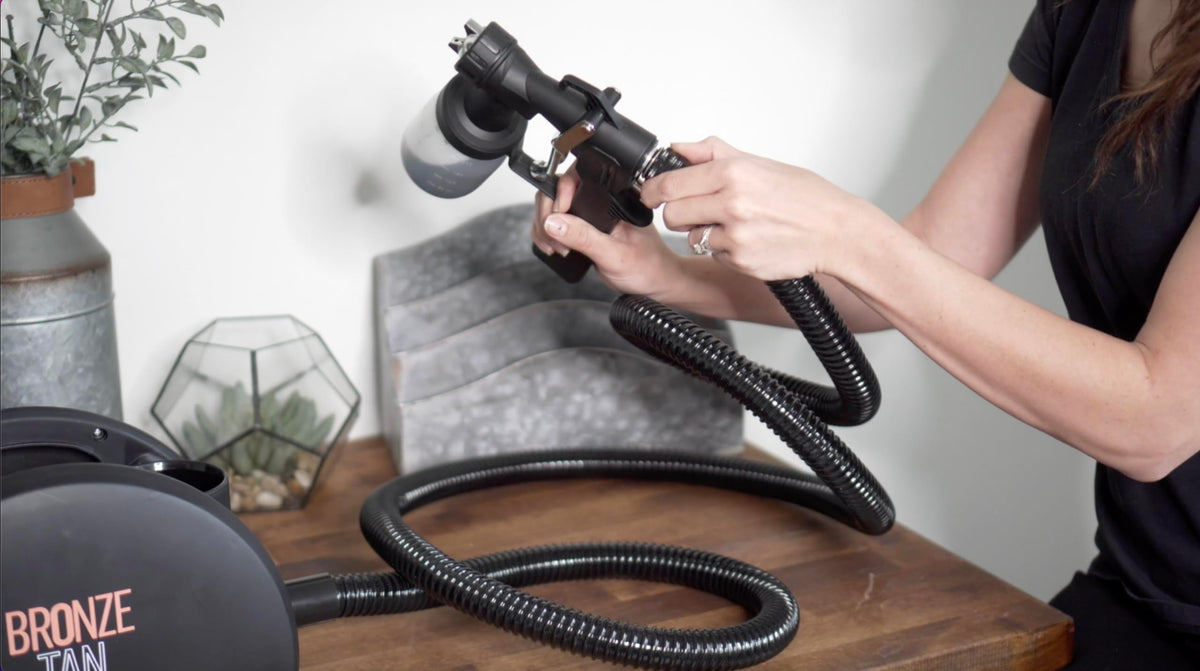 Existing Beauty gun nozzle closeup highlighting adjustable atomization for even coverage