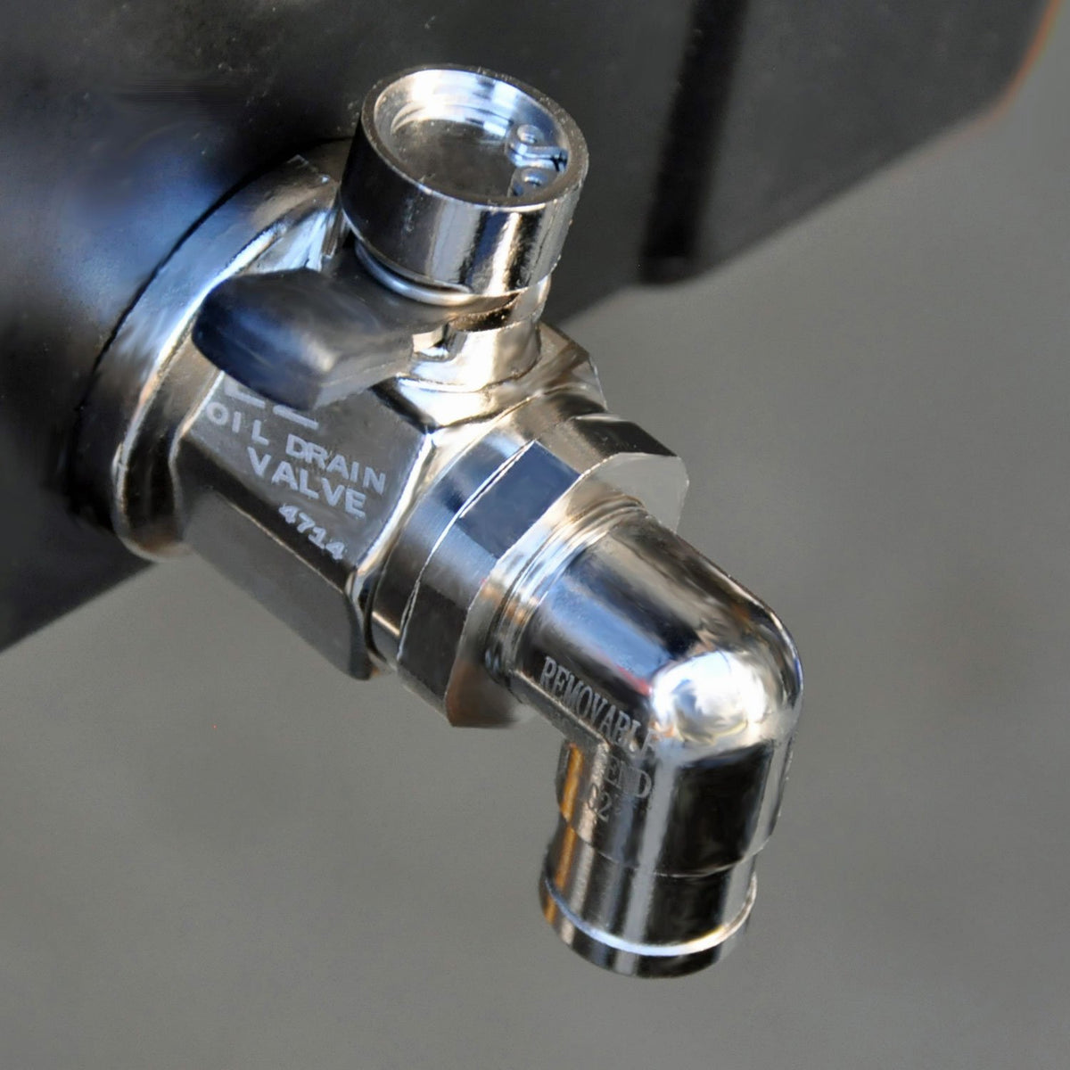 EZ Oil Drain Valve installed under vehicle demonstrating clean, controlled oil drainage and easy access