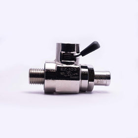 EZ Oil Drain Valve next to common wrench for scale showing compact size and easy hand-install