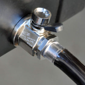 EZ Oil Drain Valve attached to drain hose over oil pan showing mess-free oil changes