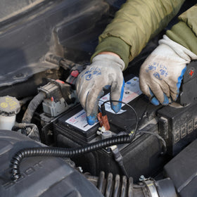 FAITIO extracting oil from car dipstick tube illustrating quick, undercarriage-free service