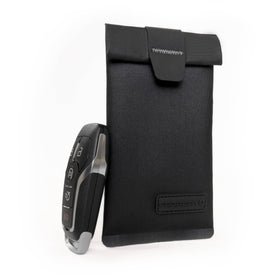 Faraday Defense pouch on entryway table illustrating everyday anti-theft use at home