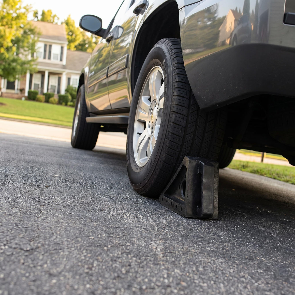 Fasmov chocks used at a campsite stabilizing a trailer for safer setup