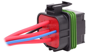Fastronix relay held in hand showing compact size and scale