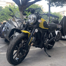 FENRIR mirrors on motorcycle in urban setting conveying stylish, practical use