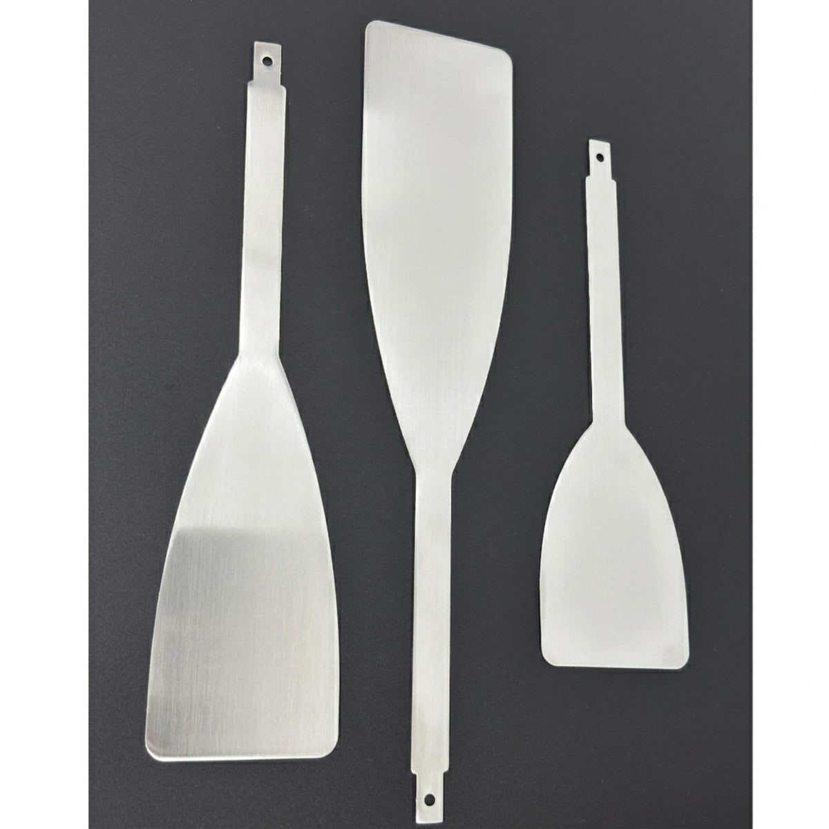 Feqaeqe blades beside ruler for size comparison showing 10,12,14 inch reach advantage