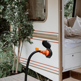 Ficstar inlet mounted on RV exterior demonstrating real-world installation benefit